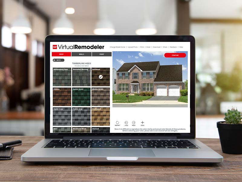 Laptop on a desk with the GAF Virtual Remodeler on the screen
